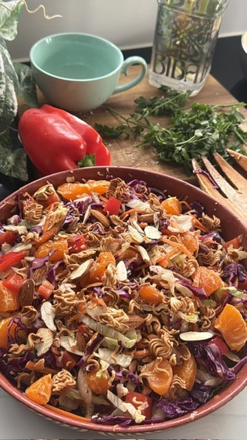 Chinese-inspired chicken salad with shredded vegetables, mandarins, almonds and crispy noodles