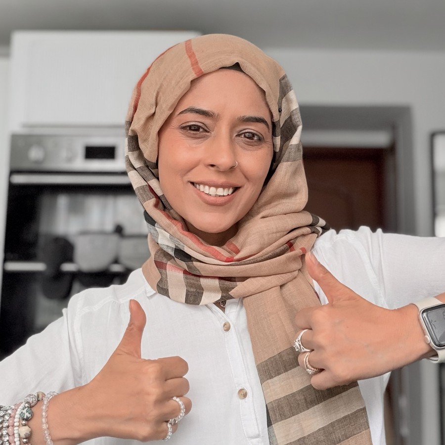 Afsheen, the cook behind Chaat Masala Cooks, smiling in her kitchen