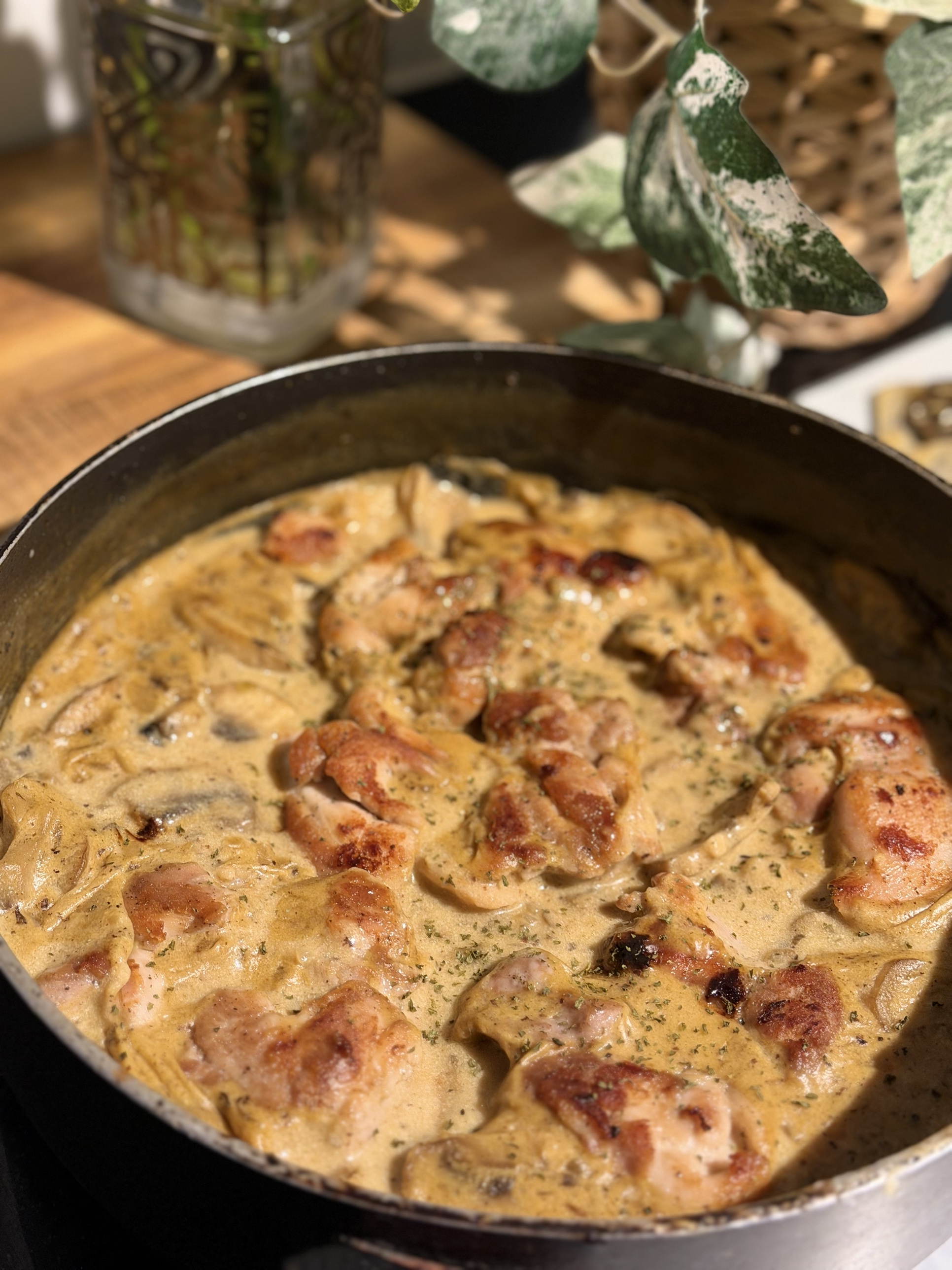 Creamy mushroom chicken thighs in a pan of mushroom gravy